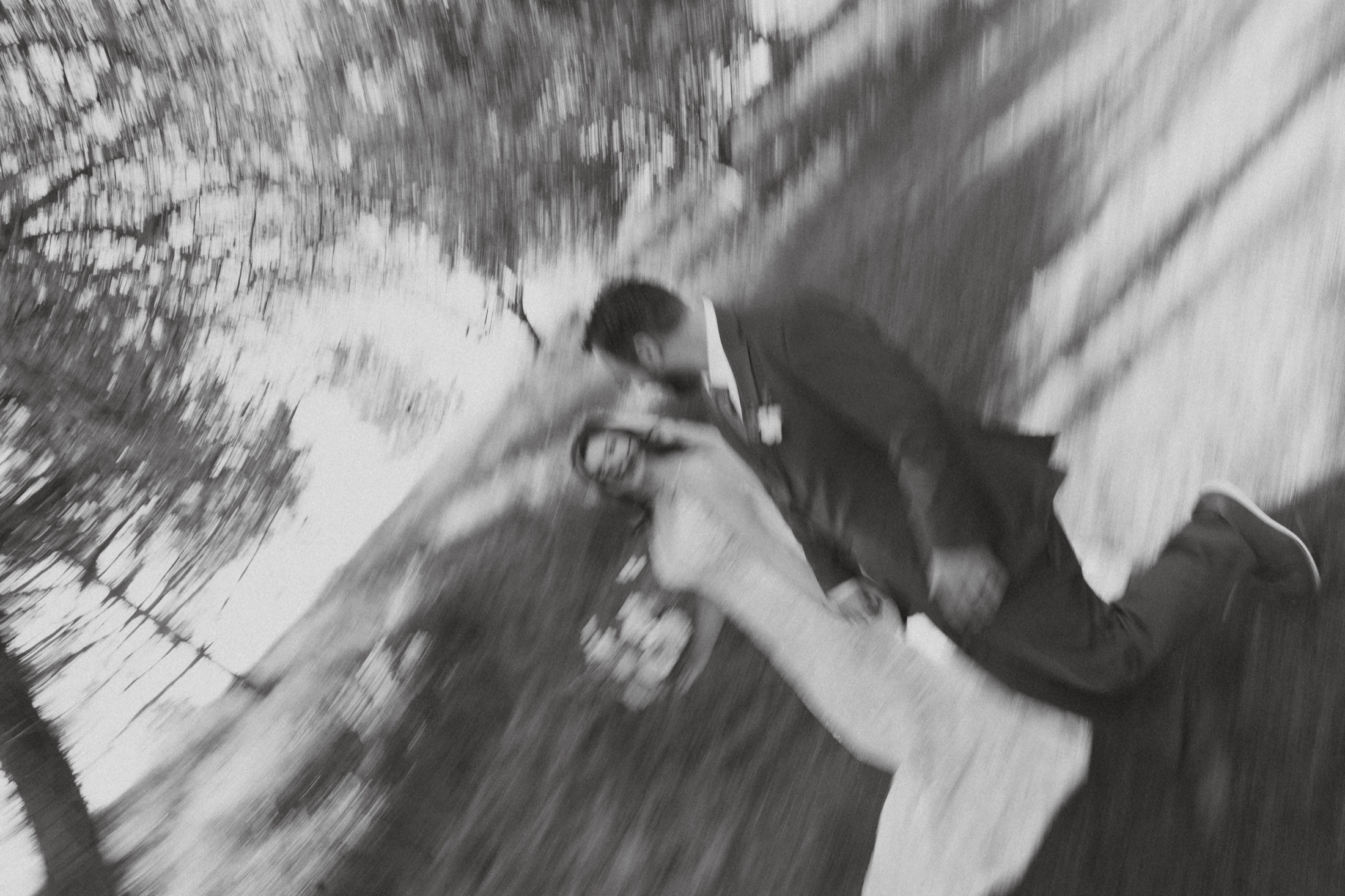 Joyful blurred dip kiss in black and white